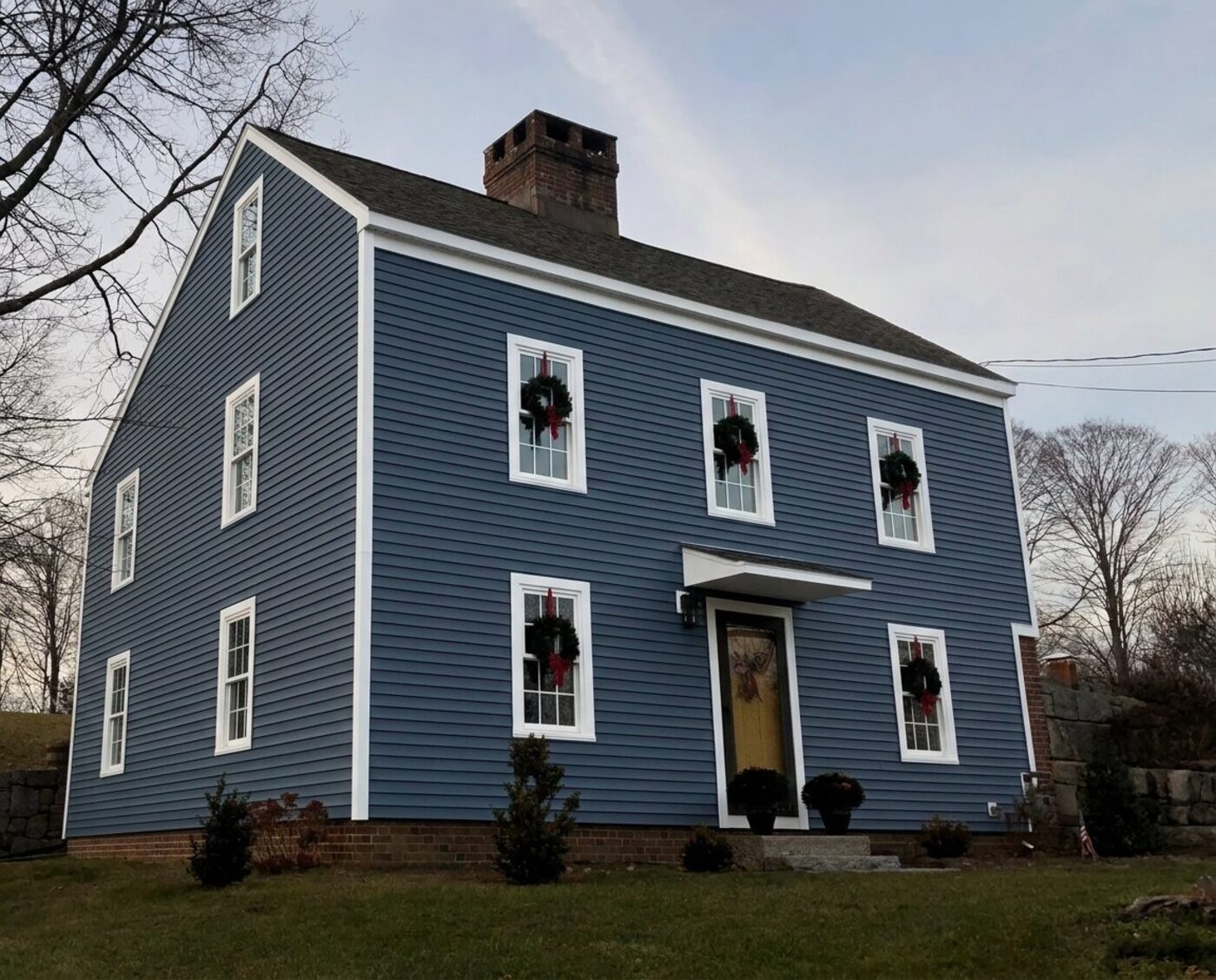 The same house with new navy siding (AI preview)