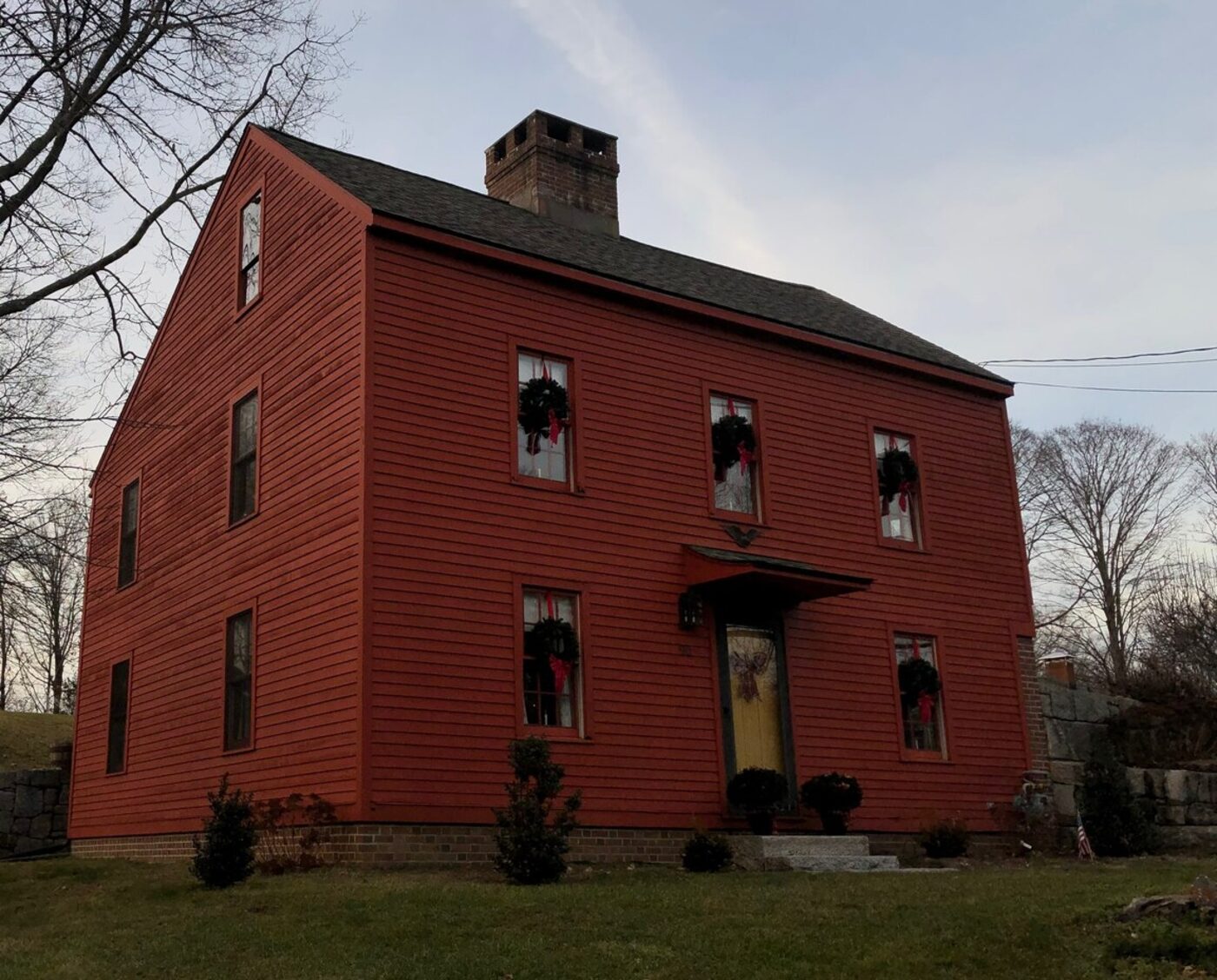 Example house today, with worn red siding